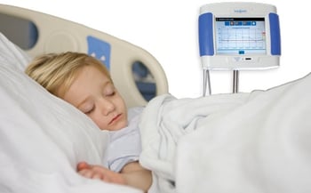 Child with hemodialysis monitor